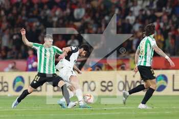 2022-04-23 - Guido Rodriguez of Real Betis and Goncalo Guedes of Valencia during the Spanish Cup, Copa del Rey, Final football match between Real Betis Balompie and Valencia CF on April 23, 2022 at Estadio de la Cartuja in Sevilla, Spain - FINAL - REAL BETIS BALOMPIE VS VALENCIA CF - SPANISH CUP - SOCCER