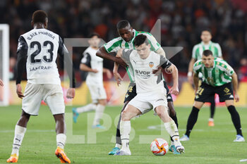2022-04-23 - Hugo Guillamon of Valencia and William Carvalho of Real Betis during the Spanish Cup, Copa del Rey, Final football match between Real Betis Balompie and Valencia CF on April 23, 2022 at Estadio de la Cartuja in Sevilla, Spain - FINAL - REAL BETIS BALOMPIE VS VALENCIA CF - SPANISH CUP - SOCCER