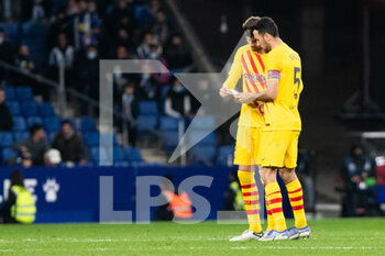 2022-02-13 - Gerard Pique and Sergio Busquets of FC Barcelona during the Spanish championship La Liga football match between RCD Espanyol and FC Barcelona on February 13, 2022 at RCD Stadium in Barcelona, Spain - RCD ESPANYOL VS FC BARCELONA - SPANISH LA LIGA - SOCCER