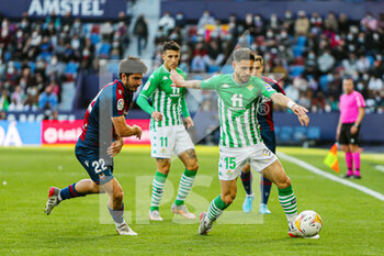 2022-02-13 - Alex Moreno of Real Betis and Gonzalo Melero of Levante during the Spanish championship La Liga football match between Levante UD and Real Betis Balompie on February 13, 2022 at the Ciutat de Valencia Stadium in Valencia, Spain - LEVANTE UD VS REAL BETIS BALOMPIE - SPANISH LA LIGA - SOCCER
