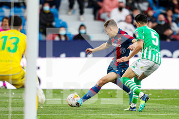 2022-02-13 - Jorge de Frutos of Levante UD and Marc Bartra of Real Betis during the Spanish championship La Liga football match between Levante UD and Real Betis Balompie on February 13, 2022 at the Ciutat de Valencia Stadium in Valencia, Spain - LEVANTE UD VS REAL BETIS BALOMPIE - SPANISH LA LIGA - SOCCER