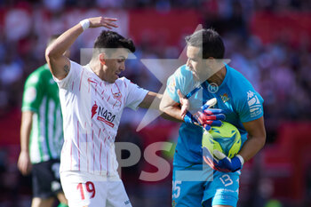 2022-02-27 - Marcos Acuna of Sevilla FC gestures with Claudio Bravo of Real Betis during the Spanish championship, La Liga football match between Sevilla FC and Real Betis on February 27, 2022 at Ramon Sanchez-Pizjuan stadium in Sevilla, Spain - SEVILLA FC VS REAL BETIS - SPANISH LA LIGA - SOCCER