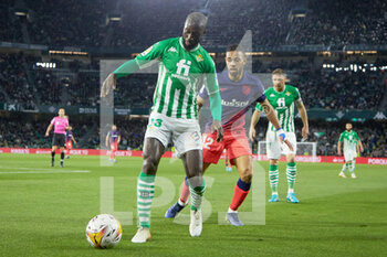 2022-03-06 - Youssouf Sabaly of Real Betis and Renan Lodi of Atletico de Madrid during the Spanish championship La Liga football match between Real Betis and Atletico de Madrid on March 6, 2022 at Benito Villamarin stadium in Sevilla, Spain - REAL BETIS VS ATLETICO DE MADRID - SPANISH LA LIGA - SOCCER