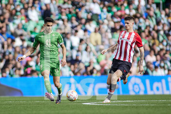 2022-03-13 - Marc Bartra of Real Betis and Oihan Sancet of Athletic Club during the Spanish championship La Liga football match between Real Betis and Athletic Club on March 13, 2022 at Benito Villamarin stadium in Sevilla, Spain - REAL BETIS VS ATHLETIC CLUB - SPANISH LA LIGA - SOCCER