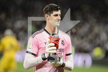 2022-03-20 - 20.03.2022, Madrid, Goalkeeper Thibaut Courtois of Real Madrid CF shows fans his player of the month trophy during the La Liga match between Real Madrid and FC Barcelona at Estadio Santiago Bernabeu on 20 March 2022 in Madrid Spain. - REAL MADRID VS FC BARCELONA - SPANISH LA LIGA - SOCCER