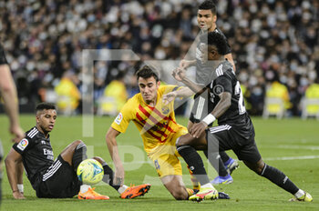 2022-03-20 - 20.03.2022, Madrid, Eric Garcia of Fc Barcelona (C) battles for the ball with Vinicius Junior of Real Madrid CF (R) and Rodrygo Goes of Real Madrid CF (L) during the La Liga match between Real Madrid and FC Barcelona at Estadio Santiago Bernabeu on 20 March 2022 in Madrid Spain. - REAL MADRID VS FC BARCELONA - SPANISH LA LIGA - SOCCER