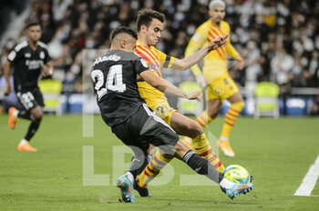 2022-03-20 - 20.03.2022, Madrid, Mariano Diaz of Real Madrid CF (L) attempts a kick while being defended by Eric Garcia of Fc Barcelona (R) during the La Liga match between Real Madrid and FC Barcelona at Estadio Santiago Bernabeu on 20 March 2022 in Madrid Spain. - REAL MADRID VS FC BARCELONA - SPANISH LA LIGA - SOCCER