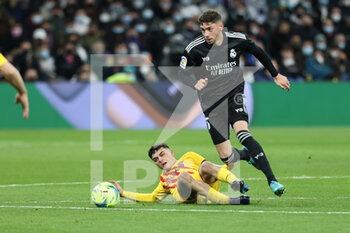 2022-03-20 - Fede Valverde of Real Madrid and Pedro "Pedri" Gonzalez of FC Barcelona during the Spanish championship La Liga football match between Real Madrid and FC Barcelona on March 20, 2022 at Santiago Bernabeu stadium in Madrid, Spain - REAL MADRID VS FC BARCELONA - SPANISH LA LIGA - SOCCER