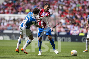 2022-04-17 - 17.04.2022, Madrid, Spain. Angel Correa  of Atletico de Madrid (R) battles for the ball with Adria Pedrosa of RCD Espanyol (L) during the LaLiga Santander match between Club Atletico de Madrid and RCD Espanyol de Barcelona at Wanda Metropolitano on 17 April 2022 in Madrid, Spain. - CLUB ATLETICO DE MADRID VS RCD ESPANYOL DE BARCELONA - SPANISH LA LIGA - SOCCER