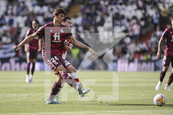 2022-05-01 - 30.04.2022, Madrid, Spain. Robin Le Normand of Real Sociedad  (L) battles for the ball with Unai Lopez of Rayo Vallecano (R) during the LaLiga Santander match between Rayo Vallecano and Real Sociedad at Estadio De Vallecas on 1 May 2022 in Madrid, Spain. - RAYO VALLECANO VS REAL SOCIEDAD - SPANISH LA LIGA - SOCCER