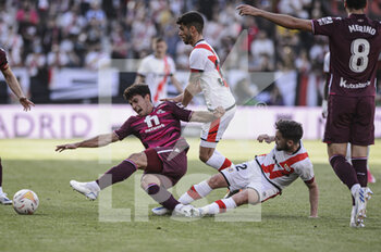 2022-05-01 - 30.04.2022, Madrid, Spain. Martin Zubimendi of Real Sociedad (L) battles for the ball with Unai Lopez of Rayo Vallecano (R) during the LaLiga Santander match between Rayo Vallecano and Real Sociedad at Estadio De Vallecas on 1 May 2022 in Madrid, Spain. - RAYO VALLECANO VS REAL SOCIEDAD - SPANISH LA LIGA - SOCCER