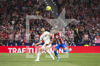 2022-05-08 - 30.04.2022, Madrid, Spain. Marco Asensio of Real Madrid CF (L) battles for the ball with Reinildo Mandava of Atletico de Madrid (R) during the LaLiga Santander match between Atletico de Madrid and Real Madrid at Wanda Metropolitano on 8 May 2022 in Madrid, Spain. - ATLETICO DE MADRID VS REAL MADRID - SPANISH LA LIGA - SOCCER