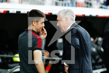 2022-05-12 - Carlo Ancelotti, coach of Real Madrid, talks to Alessio Lisci, coach of Levante during the Spanish championship La Liga football match between Real Madrid and Levante UD on May 12, 2022 at Santiago Bernabeu stadium in Madrid, Spain - REAL MADRID VS LEVANTE UD - SPANISH LA LIGA - SOCCER