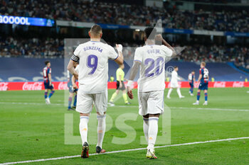 2022-05-12 - Vinicius Junior of Real Madrid celebrates a goal with Karim Benzema during the Spanish championship La Liga football match between Real Madrid and Levante UD on May 12, 2022 at Santiago Bernabeu stadium in Madrid, Spain - REAL MADRID VS LEVANTE UD - SPANISH LA LIGA - SOCCER
