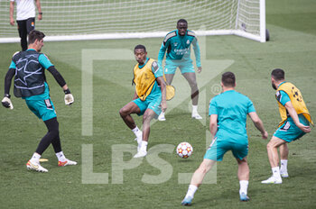2022-05-24 - 24.05.2022, Madrid, Spain. Goalkeeper Thibaut Courtois of Real Madrid CF (L) battles for the ball with David Alaba of Real Madrid CF (R) during open media day Real Madrid at Ciudad deportiva Real Madrid on 24 Mal 2022 in Madrid Spain. - OPEN MEDIA DAY REAL MADRID - SPANISH LA LIGA - SOCCER