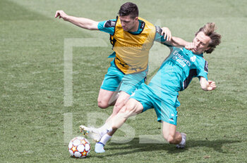 2022-05-24 - 24.05.2022, Madrid, Spain. Luka Jovic of Real Madrid CF (L) battles for the ball with Luka Modric of Real Madrid CF (R) during open media day Real Madrid at Ciudad deportiva Real Madrid on 24 Mal 2022 in Madrid Spain. - OPEN MEDIA DAY REAL MADRID - SPANISH LA LIGA - SOCCER