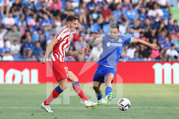 2022-08-15 - Saul Niguez of Atletico de Madrid and Juan Iglesias of Getafe during the Spanish championship La Liga football match between Getafe CF and Atletico de Madrid on August 15, 2022 at Coliseum Alfonso Perez stadium in Getafe, Madrid, Spain - FOOTBALL - SPANISH CHAMP - GETAFE V ATLETICO MADRID - SPANISH LA LIGA - SOCCER