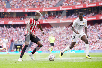 2022-08-21 - Inaki Williams of Athletic Club competes for the ball with Mouctar Diakhaby of Valencia during the Spanish championship La Liga football match between Athletic Club and Valencia CF on August 21, 2022 at San Mames stadium in Bilbao, Spain - FOOTBALL - SPANISH CHAMP - ATHLETIC BILBAO V VALENCIA - SPANISH LA LIGA - SOCCER