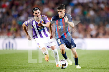 2022-08-28 - Pedri Gonzalez of FC Barcelona and Kike Perez of Real Valladolid during the Spanish championship La Liga football match between FC Barcelona and Real Valladolid CF on August 28, 2022 at Spotify Camp Nou in Barcelona, Spain - FOOTBALL - SPANISH CHAMP - FC BARCELONA V REAL VALLADOLID - SPANISH LA LIGA - SOCCER