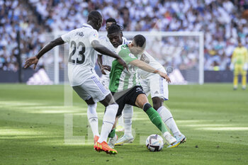 2022-09-03 - 03.09.2022, Madrid, Spain. Guido Rodriguez of Real Betis (C) battles for the ball with Ferland Mendy of Real Madrid CF (L) and Eduardo Camavinga of Real Madrid CF (R) during the LaLiga Santander match between Real Madrid CF and Real Betis at Santiago Bernabeu on 3 September 2022 in Madrid, Spain. - LALIGA SANTANDER 2021/2023- REAL MADRID VS REAL BETIS - SPANISH LA LIGA - SOCCER