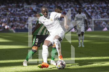 2022-09-03 - Ferland Mendy of Real Madrid CF (L) and Guido Rodriguez of Real Betis (R) during the Spanish championship La Liga football match between Real Madrid and Real Betis on September 3, 2022 at Santiago Bernabeu stadium in Madrid, Spain - FOOTBALL - SPANISH CHAMP - REAL MADRID V REAL BETIS - SPANISH LA LIGA - SOCCER