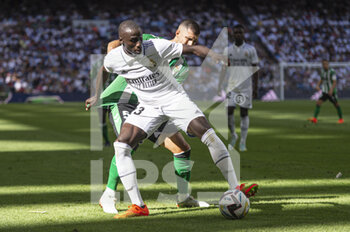 2022-09-03 - Ferland Mendy of Real Madrid CF (L) and Guido Rodriguez of Real Betis (R) during the Spanish championship La Liga football match between Real Madrid and Real Betis on September 3, 2022 at Santiago Bernabeu stadium in Madrid, Spain - FOOTBALL - SPANISH CHAMP - REAL MADRID V REAL BETIS - SPANISH LA LIGA - SOCCER