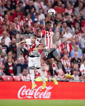 2022-09-17 - Fran Garcia of Rayo Vallecano competes for the ball with Nico Williams of Athletic Club during the La Liga Santander football match between Athletic Club and Rayo Vallecano at San Mames on September 17, 2022, in Bilbao, Spain. Photo Ricardo Larreina / SpainDPPI / DPPI - FOOTBALL - SPANISH CHAMP - ATHLETIC V RAYO VALLECANO - SPANISH LA LIGA - SOCCER