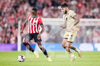 2022-09-30 - Inaki Williams of Athletic Club competes for the ball with Same Costa of UD Almeria during the Spanish championship La Liga football match between Athletic Club and UD Almeria on September 30, 2022 at San Mames in Bilbao, Spain - FOOTBALL - SPANISH CHAMP - ATHLETIC CLUB V ALMERIA - SPANISH LA LIGA - SOCCER