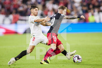 2022-10-08 - Gonzalo Montiel of Sevilla FC and Iker Muniain of Athletic Club during the Spanish championship La Liga football match between Sevilla FC and Athletic Club on October 8, 2022 at Ramon Sanchez Pizjuan stadium in Sevilla, Spain - FOOTBALL - SPANISH CHAMP - SEVILLA V ATHLETIC - SPANISH LA LIGA - SOCCER