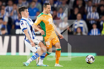 2022-10-30 - Jose Andres Guardado of Real Betis Balompie competes for the ball with Pablo Marin of Real Sociedad during the Spanish championship La Liga football match between Real Sociedad and Real Betis Balompie on October 30, 2022 at Reale Arena in San Sebastian, Spain - FOOTBALL - SPANISH CHAMP - REAL SOCIEDAD V REAL BETIS - SPANISH LA LIGA - SOCCER