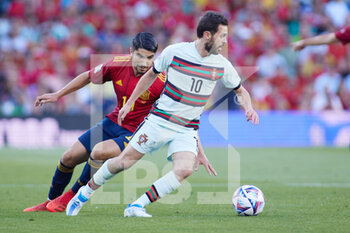 2022-06-02 - Bernardo Silva of Portugal and Carlos Soler of Spain during the UEFA Nations League, League A - Group A2 football match between Spain and Portugal on June 2, 2022 at Benito Villamarin stadium in Sevilla, Spain - FOOTBALL - NATIONS LEAGUE - SPAIN V PORTUGAL - UEFA NATIONS LEAGUE - SOCCER