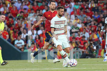 2022-06-02 - Bruno Fernandes of Portugal and Sergio Busquets of Spain during the UEFA Nations League, League A - Group A2 football match between Spain and Portugal on June 2, 2022 at Benito Villamarin stadium in Sevilla, Spain - FOOTBALL - NATIONS LEAGUE - SPAIN V PORTUGAL - UEFA NATIONS LEAGUE - SOCCER