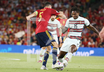 2022-06-02 - Rafael Leao of Portugal and Sergio Busquets of Spain during the UEFA Nations League, League A - Group A2 football match between Spain and Portugal on June 2, 2022 at Benito Villamarin stadium in Sevilla, Spain - FOOTBALL - NATIONS LEAGUE - SPAIN V PORTUGAL - UEFA NATIONS LEAGUE - SOCCER