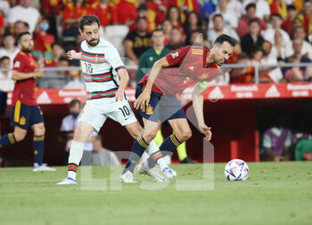 2022-06-02 - Bernardo Silva of Portugal and Sergio Busquets of Spain during the UEFA Nations League, League A - Group A2 football match between Spain and Portugal on June 2, 2022 at Benito Villamarin stadium in Sevilla, Spain - FOOTBALL - NATIONS LEAGUE - SPAIN V PORTUGAL - UEFA NATIONS LEAGUE - SOCCER