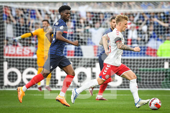 2022-06-03 - Aurelien TCHOUAMENI of France and Daniel WASS of Denmark during the UEFA Nations League, League A - Group 1 football match between France and Denmark on June 3, 2022 at Stade de France in Saint-Denis near Paris, France - FOOTBALL - NATIONS LEAGUE - FRANCE V DENMARK - UEFA NATIONS LEAGUE - SOCCER