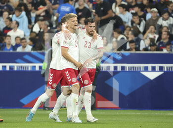 2022-06-03 - Andreas Cornelius of Denmark #21 celebrates his first goal with Pierre-Emile Hojbjerg during the UEFA Nations League League A - Group 1 football match between France and Denmark on June 3, 2022 at Stade de France in Saint-Denis near Paris, France - FOOTBALL - NATIONS LEAGUE - FRANCE V DENMARK - UEFA NATIONS LEAGUE - SOCCER