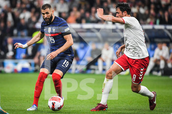 2022-06-03 - Karim BENZEMA of France and Thomas DELANEY of Denmark during the UEFA Nations League, League A - Group 1 football match between France and Denmark on June 3, 2022 at Stade de France in Saint-Denis near Paris, France - FOOTBALL - NATIONS LEAGUE - FRANCE V DENMARK - UEFA NATIONS LEAGUE - SOCCER