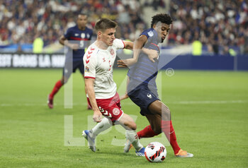 2022-06-03 - Joakim Maehle of Denmark, Kingsley Coman of France during the UEFA Nations League League A - Group 1 football match between France and Denmark on June 3, 2022 at Stade de France in Saint-Denis near Paris, France - FOOTBALL - NATIONS LEAGUE - FRANCE V DENMARK - UEFA NATIONS LEAGUE - SOCCER