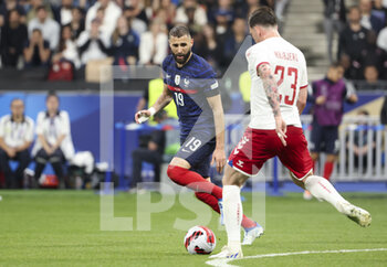 2022-06-03 - Karim Benzema of France, Pierre-Emile Hojbjerg of Denmark during the UEFA Nations League League A - Group 1 football match between France and Denmark on June 3, 2022 at Stade de France in Saint-Denis near Paris, France - FOOTBALL - NATIONS LEAGUE - FRANCE V DENMARK - UEFA NATIONS LEAGUE - SOCCER