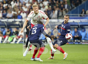2022-06-03 - Andreas Cornelius of Denmark, N'Golo Kante, Antoine Griezmann of France during the UEFA Nations League League A - Group 1 football match between France and Denmark on June 3, 2022 at Stade de France in Saint-Denis near Paris, France - FOOTBALL - NATIONS LEAGUE - FRANCE V DENMARK - UEFA NATIONS LEAGUE - SOCCER