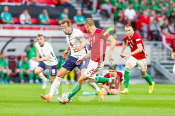 2022-06-04 - Harry Kane (9) of England of England battles with Adam Lang (2) of Hungary during the UEFA Nations League, League A - Group 3 football match between Hungary and England on June 4, 2022 at Puskas Arena Park in Budapest, Hungary - FOOTBALL - NATIONS LEAGUE 2022 - HUNGARY V ENGLAND - UEFA NATIONS LEAGUE - SOCCER