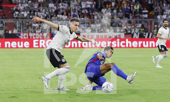 2022-06-07 - Nico Schlotterbeck of Germany and Jude Bellingham of England during the UEFA Nations League 2022, League A - Group 3 football match between Germany and England on June 7, 2022 at Allianz Arena in Munich, Germany - FOOTBALL - NATIONS LEAGUE 2022 - GERMANY V ENGLAND - UEFA NATIONS LEAGUE - SOCCER