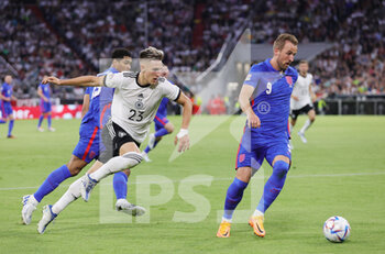 2022-06-07 - Harry Kane of England and Nico Schlotterbeck of Germany during the UEFA Nations League 2022, League A - Group 3 football match between Germany and England on June 7, 2022 at Allianz Arena in Munich, Germany - FOOTBALL - NATIONS LEAGUE 2022 - GERMANY V ENGLAND - UEFA NATIONS LEAGUE - SOCCER