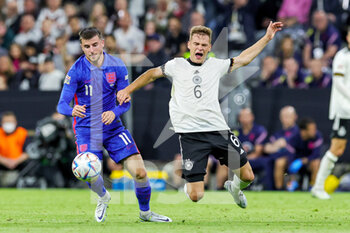 2022-06-07 - Mason Mount (11) of England tussles with Joshua Kimmich (6) of Germany during the UEFA Nations League 2022, League A - Group 3 football match between Germany and England on June 7, 2022 at Allianz Arena in Munich, Germany - FOOTBALL - NATIONS LEAGUE 2022 - GERMANY V ENGLAND - UEFA NATIONS LEAGUE - SOCCER