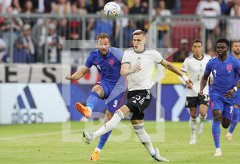 2022-06-07 - Harry Kane of England and Nico Schlotterbeck of Germany during the UEFA Nations League 2022, League A - Group 3 football match between Germany and England on June 7, 2022 at Allianz Arena in Munich, Germany - FOOTBALL - NATIONS LEAGUE 2022 - GERMANY V ENGLAND - UEFA NATIONS LEAGUE - SOCCER