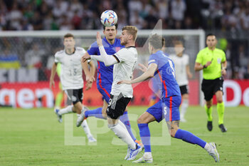 2022-06-07 - Timo Werner of Germany and John Stones of England during the UEFA Nations League 2022, League A - Group 3 football match between Germany and England on June 7, 2022 at Allianz Arena in Munich, Germany - FOOTBALL - NATIONS LEAGUE 2022 - GERMANY V ENGLAND - UEFA NATIONS LEAGUE - SOCCER