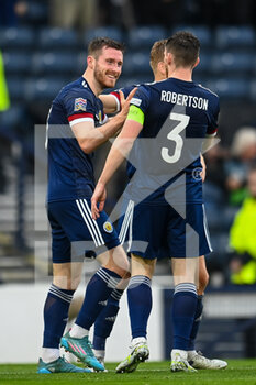 2022-06-08 - Scotland's Anthony Ralston is all smiles as he celebrates with Scotland's Andy Robertson after scoring the opening goal during the UEFA Nations League 2022, League B - Group 1 football match between Scotland and Armenia on June 8, 2022 at Hampden Park in Glasgow, Scotland - FOOTBALL - NATIONS LEAGUE 2022 - SCOTLAND V ARMENIA - UEFA NATIONS LEAGUE - SOCCER