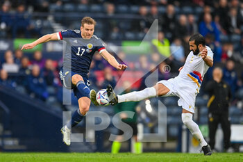 2022-06-08 - Scotland's Stuart Armstrong and Armenia's Artak Grigoryan complete for the ball during the UEFA Nations League 2022, League B - Group 1 football match between Scotland and Armenia on June 8, 2022 at Hampden Park in Glasgow, Scotland - FOOTBALL - NATIONS LEAGUE 2022 - SCOTLAND V ARMENIA - UEFA NATIONS LEAGUE - SOCCER