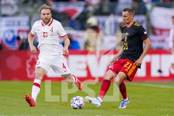 2022-06-08 - Tymoteusz Puchacz of Poland, Timothy Castagne of Belgium during the UEFA Nations League 2022, League A - Group 4 football match between Belgium and Poland on June 8, 2022 at King Baudouin Stadium in Brussels, Belgium - FOOTBALL - NATIONS LEAGUE 2022 - BELGIUM V POLAND - UEFA NATIONS LEAGUE - SOCCER