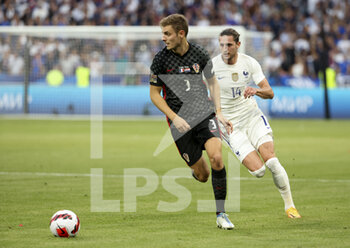 2022-06-13 - Borna Barisic of Croatia, Adrien Rabiot of France during the UEFA Nations League, League A - Group 1 football match between France and Croatia on June 13, 2022 at Stade de France in Saint-Denis near Paris, France - FOOTBALL - NATIONS LEAGUE - FRANCE V CROATIA - UEFA NATIONS LEAGUE - SOCCER